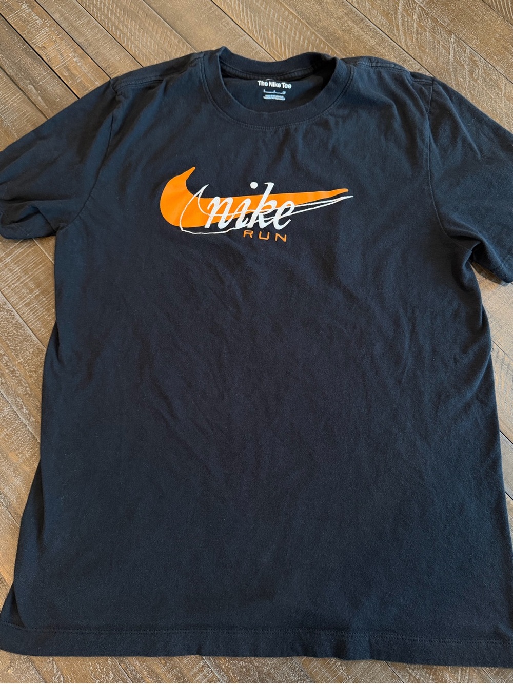 Nike Black Short Sleeve Tee with Orange Swoosh and White Script